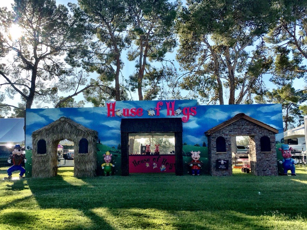 The 2017 Three Little Pigs themed booth with straw, stick and brick houses
