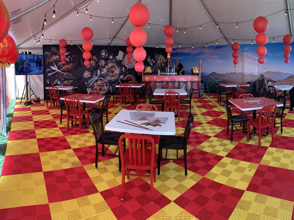 The 2019 Year of the Pig booth interior with red lanterns and a Great Wall mural