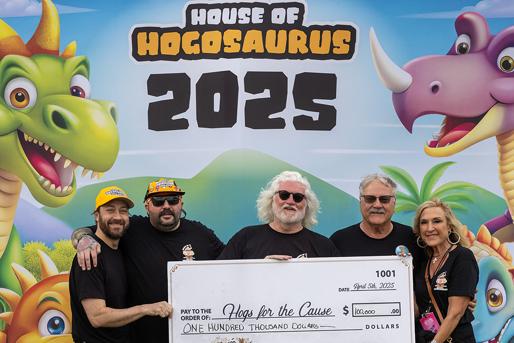 House of Hogs presenting a donation check