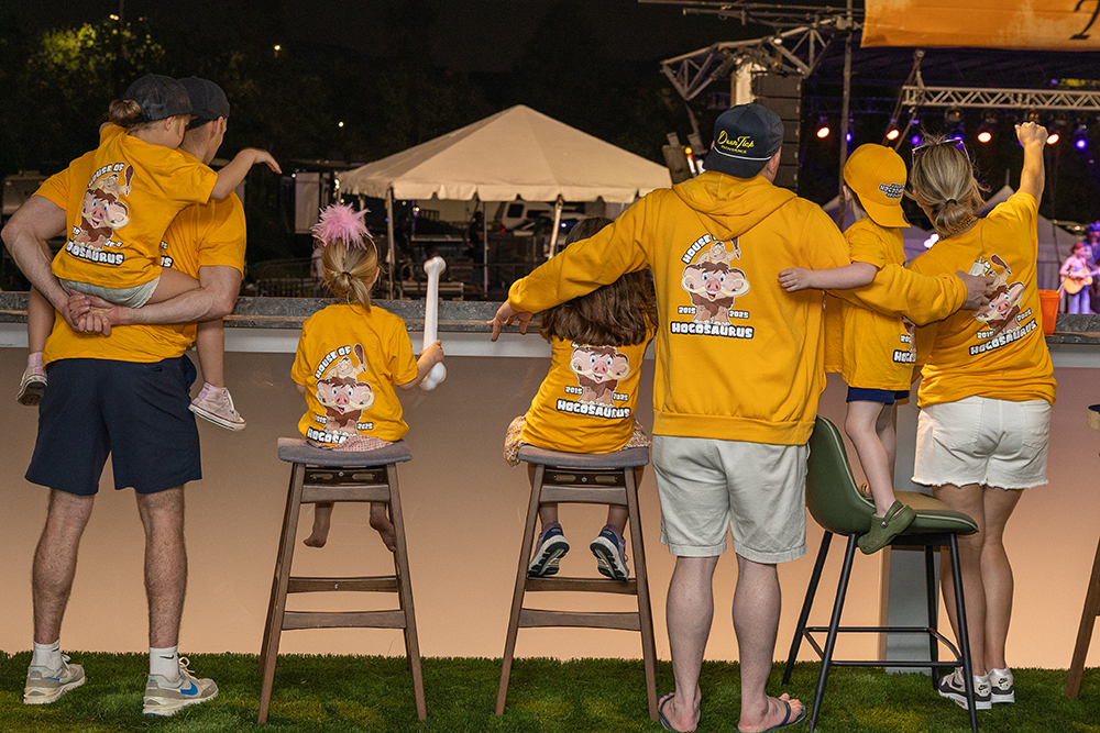 A family watching live music together at a House of Hogs fundraising event