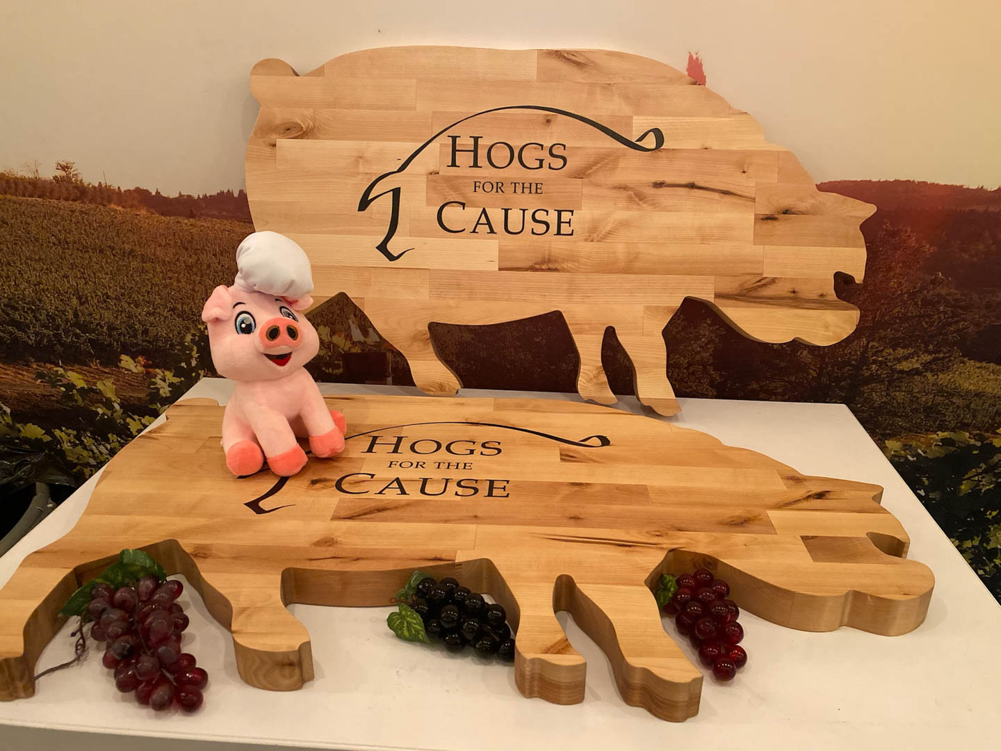 Hogs for the Cause carving boards with the House of Hogs pig mascot
