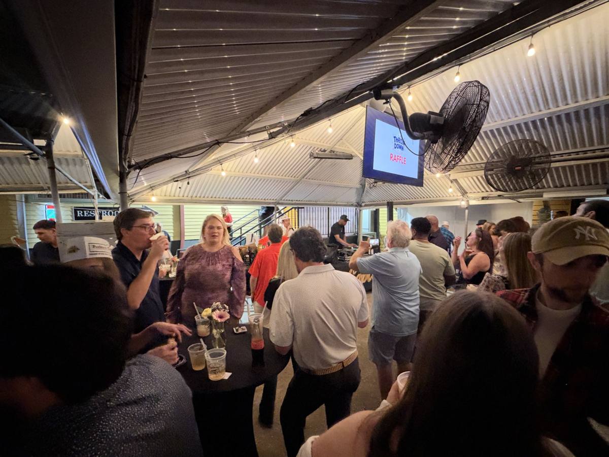 Guests filling the covered courtyard at Parkway Bakery & Tavern