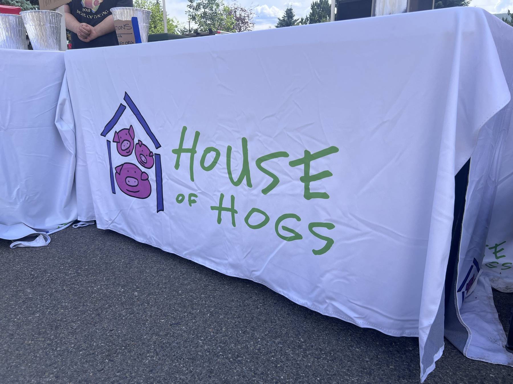 The House of Hogs banner across our booth table at Art in Washoe Park